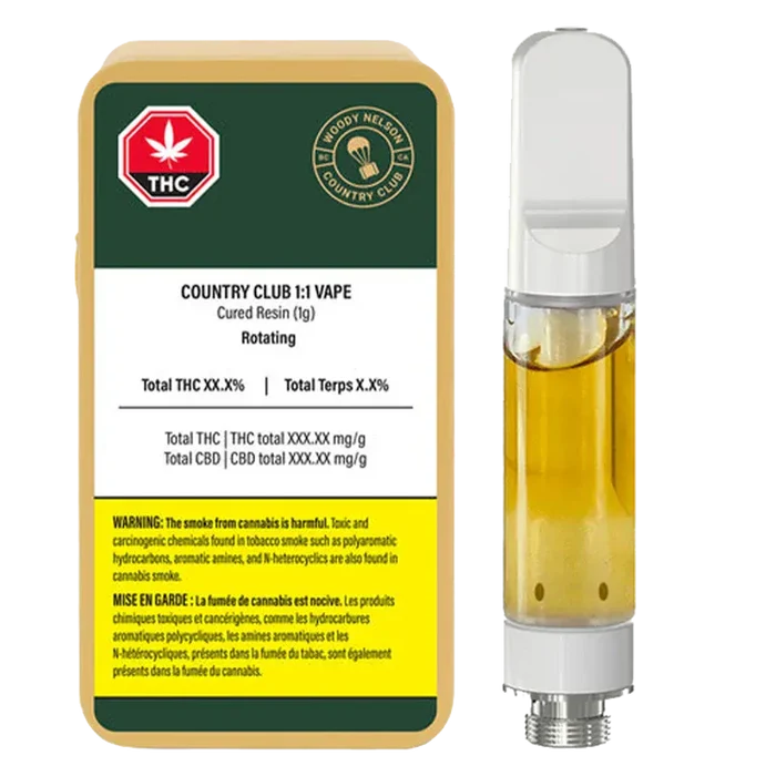 Front-facing shot of the 1:1 Vape Cartridge next to its Woody Nelson Country Club labeled 1 g carton, both shown on a white background.