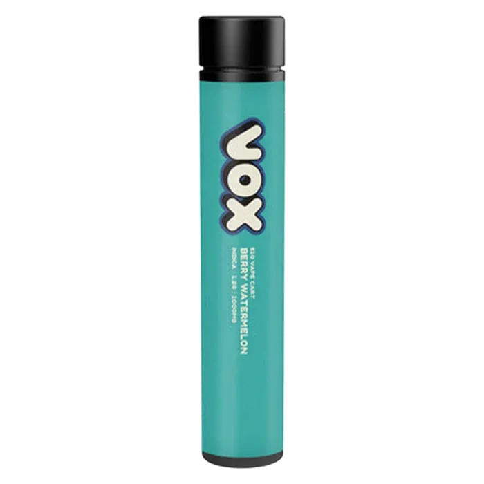 Vertical studio shot of a teal VOX Berry Watermelon Vape Cartridge with a black cap against a pale gradient background