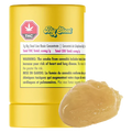 Close-up of a yellow tub labeled Big Steal Live Rosin with a glossy caramel-colored dab of concentrate in front.