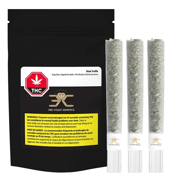 Front-facing shot of a black pouch alongside three glass-tipped joints, labeled "Black Truffle Glass Tip PR 3 x 1 g" and showing the 3rd Coast Genetics logo.