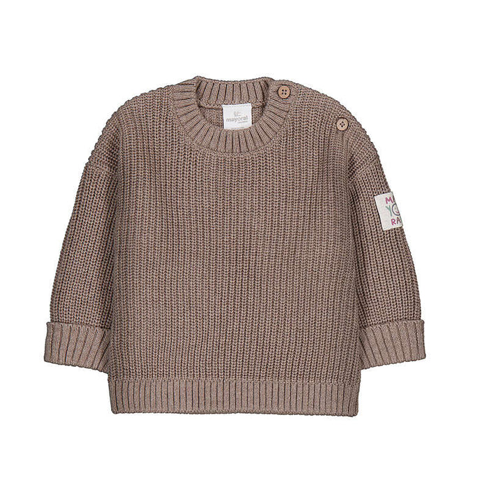 A toddler's chunky knit sweater in a warm taupe-brown color, featuring a crew neck, button closures on the shoulders, ribbed cuffs, and a small floral patch on the left sleeve.