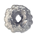 Decorative silver wreath-shaped object with a bow on a white background