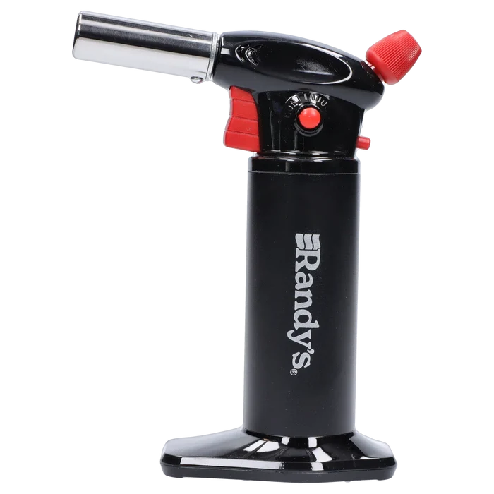 Side profile of Randy's Fahrenheit Butane Torch - Black showing the upright black cylinder with white logo, angled metal nozzle, and red control accents.