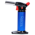 Side view of Randy's Fahrenheit Butane Torch - Blue showing the blue cylindrical body with white logo, black top and base, and red controls.