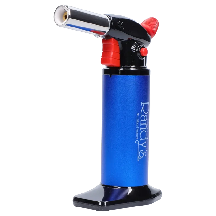 Side view close-up of Randy's Fahrenheit Butane Torch - Blue showing its metallic blue cylinder, black top with red controls, and angled chrome nozzle.